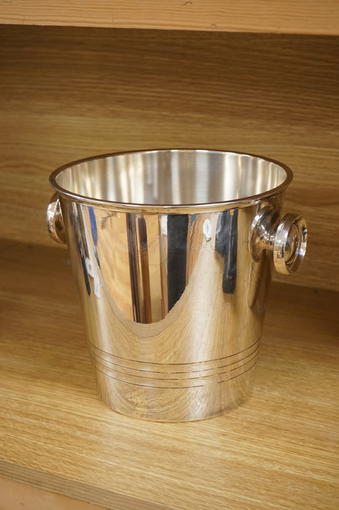A plated champagne bucket and an ice bucket, St Medard, largest 19cm high